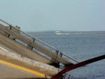 A boat crosses the area where the new bridge is to be constructed.