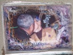 Kiss. Small photo album on ground in Gentilly