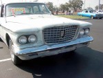 This is a tired car in need of a complete restoration. Note the rot holes in the hood and missing parking light lenses.