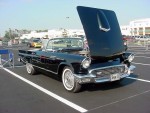 This was The Petal's favorite ride. It is a 1957? Ford Thunderbird. Early Thunderbirds were little more than a huge engine and transmission and, I believe, the proper ancestors of the Mustang. Later the T-bird would become an enormous car bearing little resemblence to its roots. 