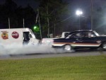 A 56 Chevy smokes about 20,000 miles worth of rubber in preparation for another race.