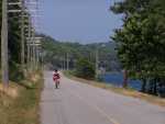Uphill, against the wind and with a partially flat tire, Petal begins the return trip.