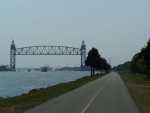 This is the railroad bridge in Bourne. It is a unique design, with the center section lowering when needed to allow the train to cross. The new windmill at Mass Maritime Academy is visible to the right.